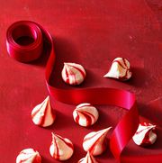 peppermint meringues on a red background with ribbon