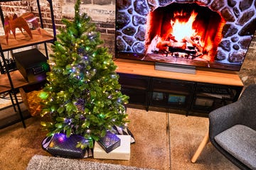 presents under artificial christmas tree