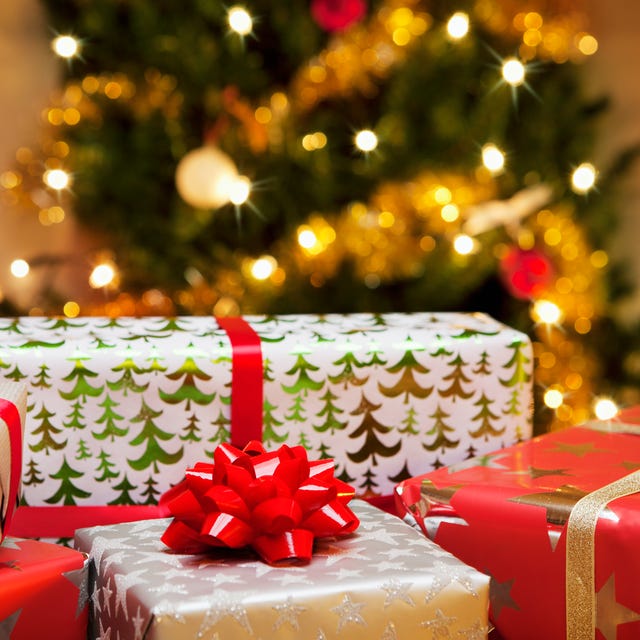 christmas gifts in front of tree