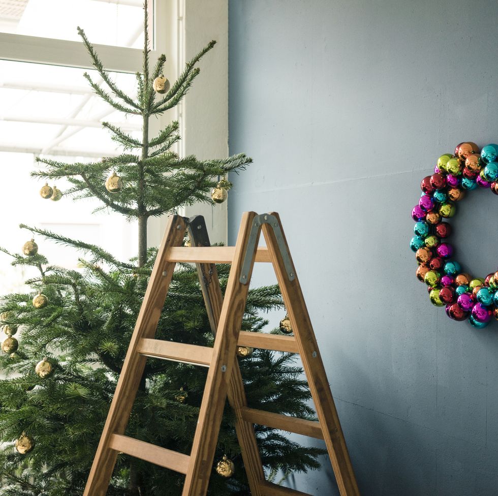 Christmas tree, Christmas wreath and ladder in a loft