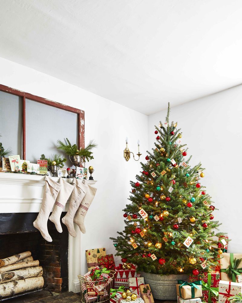 christmas tree with bright ornaments and presents