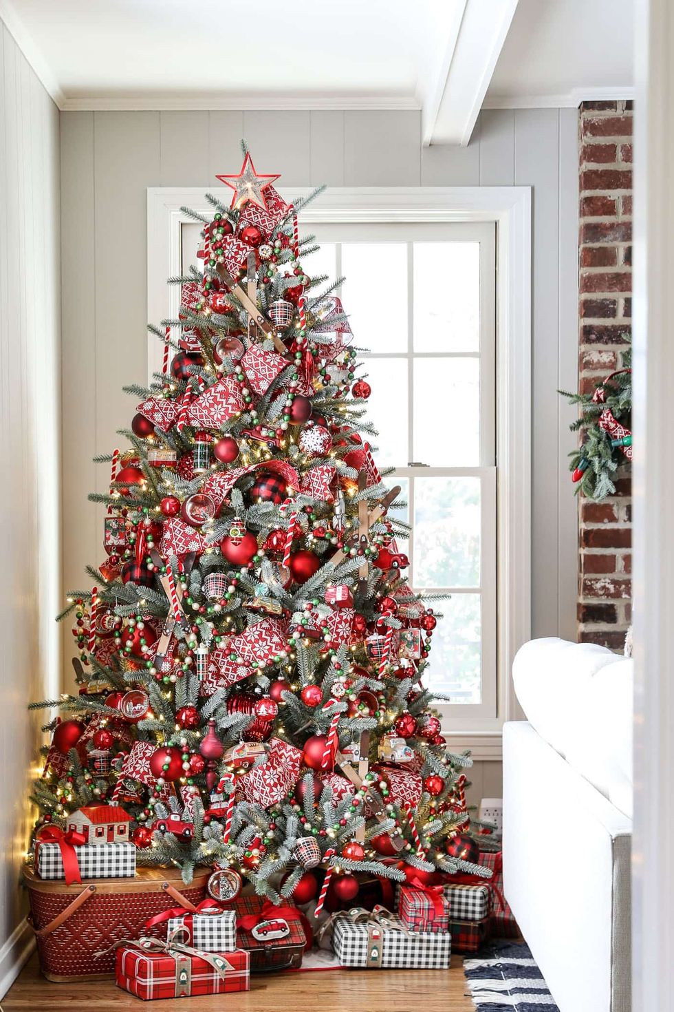 cozy lodge christmas tree with reds and golds