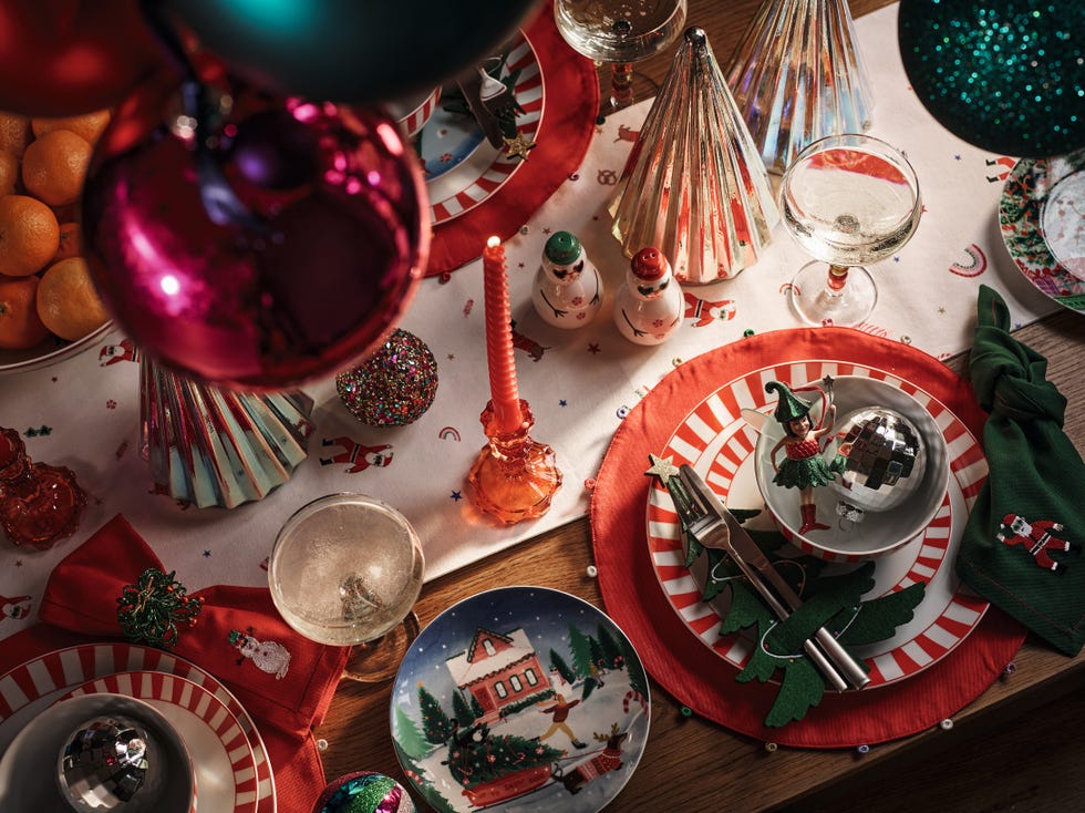 christmas table setting with festive tableware