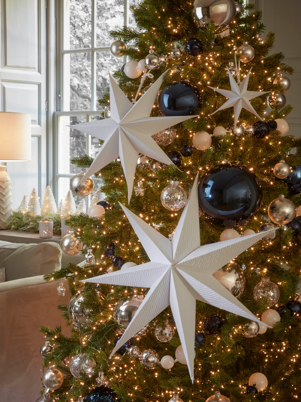 large paper stars on christmas tree