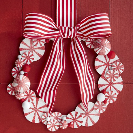 red and white striped peppermint wreath and wooden and pine wreath