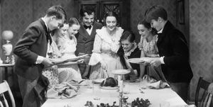the cratchit family at christmas dinner in a scene from 'a christmas carol', directed by edwin l marin, 1938 from third left, june lockhart, gene lockhart, kathleen lockhart and terry kilburn