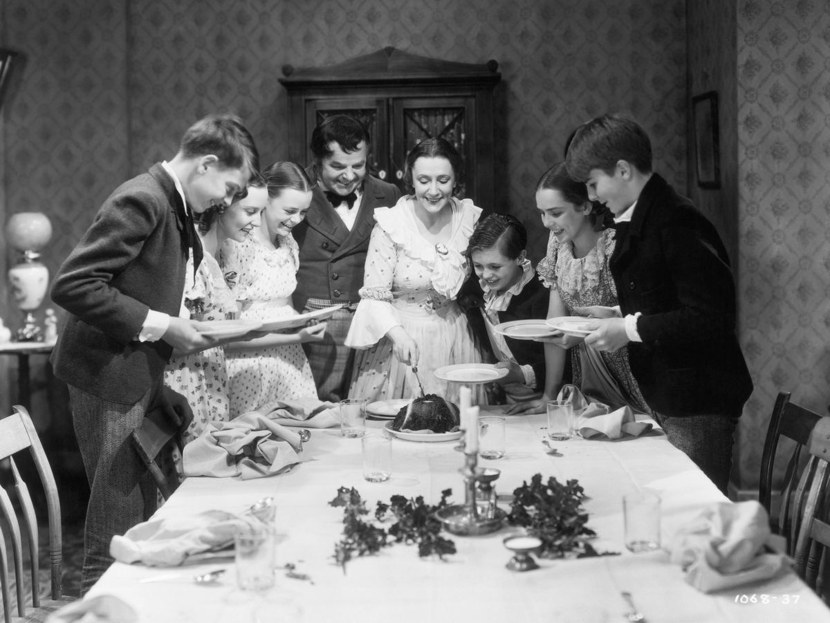 the cratchit family at christmas dinner in a scene from 'a christmas carol', directed by edwin l marin, 1938 from third left, june lockhart, gene lockhart, kathleen lockhart and terry kilburn