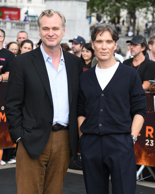 christopher nolan and cillian murphy standing shoulder to shoulder for a photo