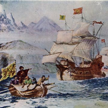 ferdinand magellan with a crew of men sailing in a small boat as large ships wait in the background