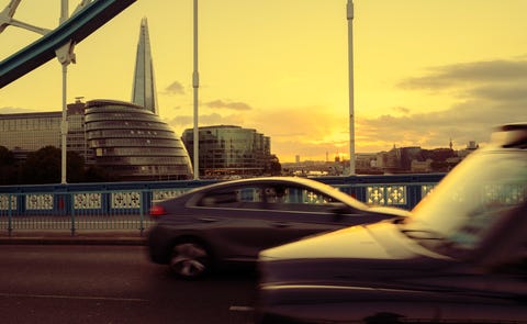 city road and london southwark skyline at sunset