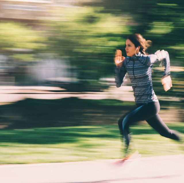 woman running down path in a blur