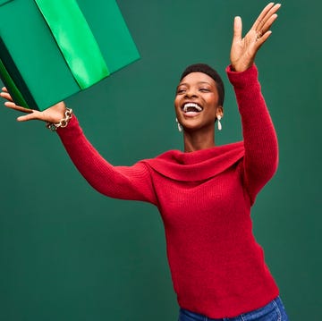 woman catching holiday gift woman catching holiday gift