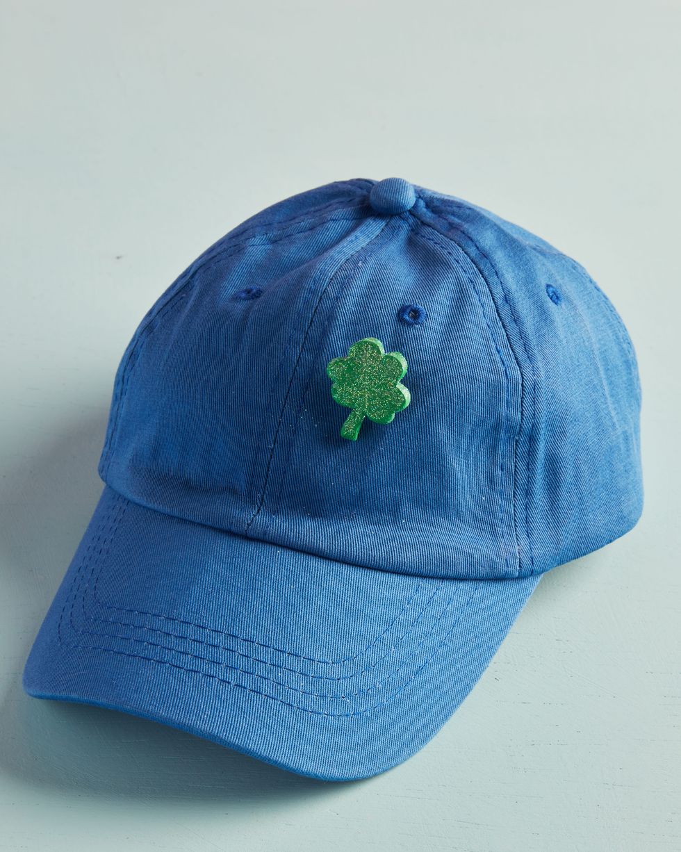 mini four leaf clover pin crafted for st patrick's day attached denim blue baseball cap