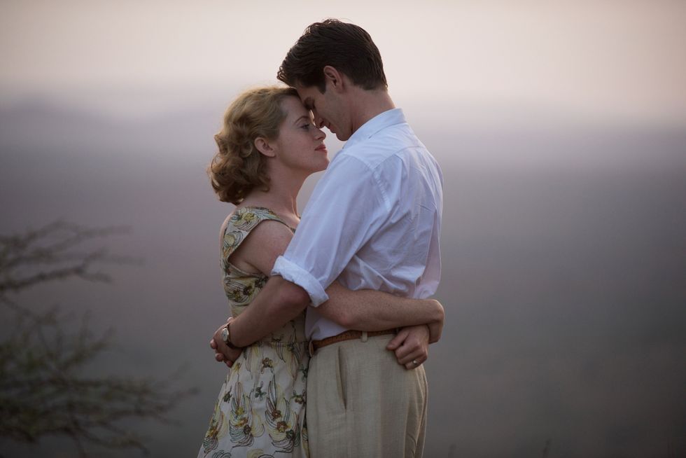 Claire Foy as Diana Cavendish, Andrew Garfield as Robin Cavendish hug in the film Breath
