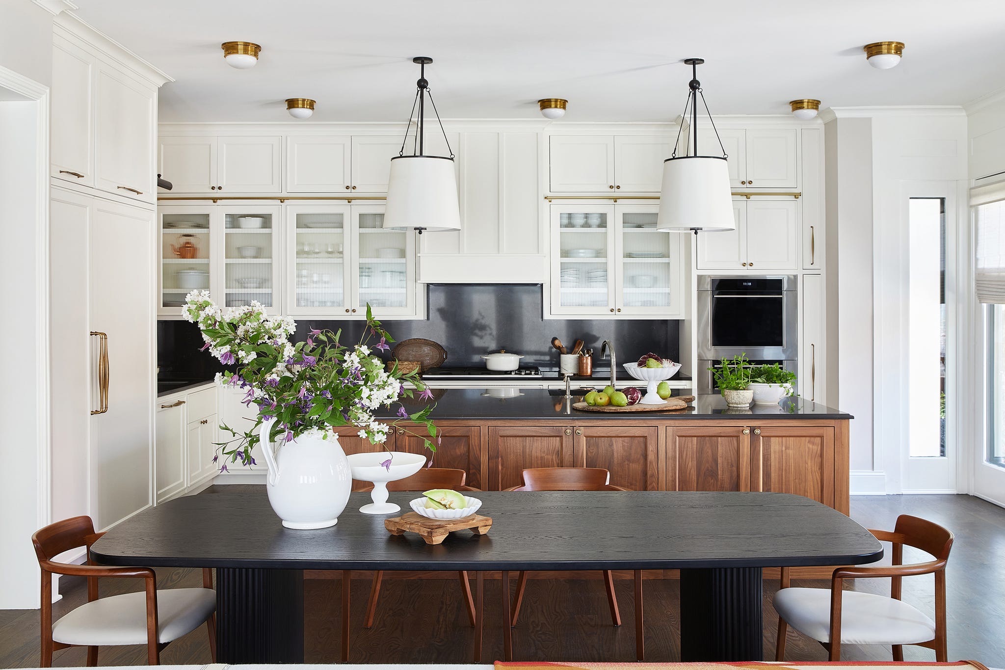 kitchen island with a table in front of it