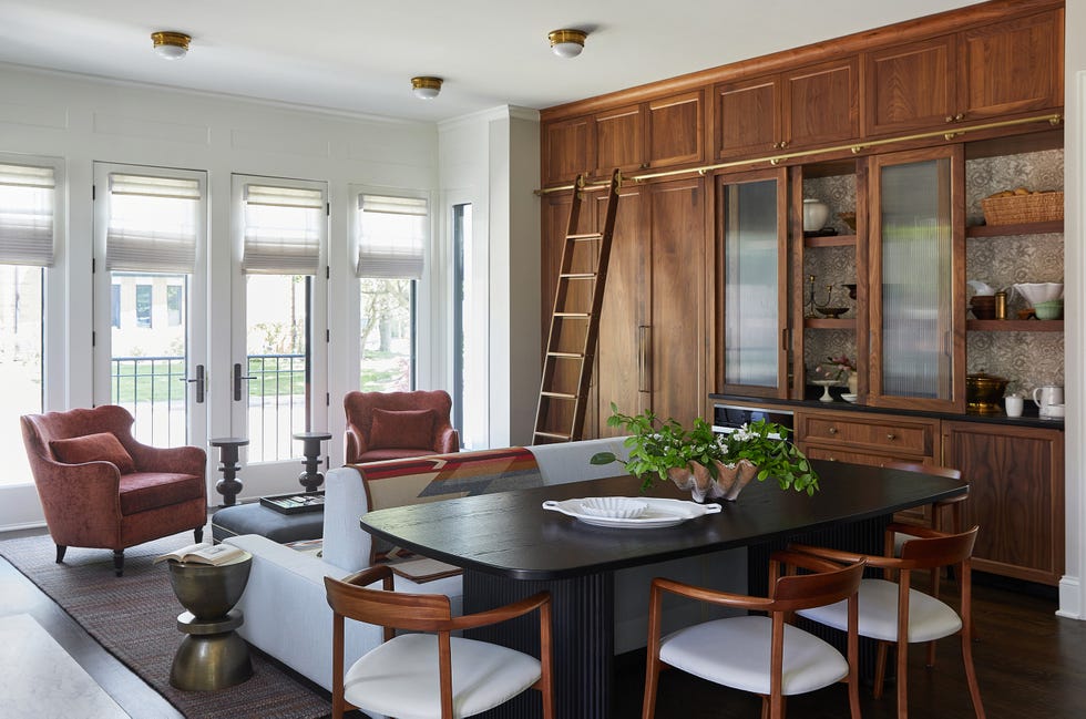 a dining room with a table and chairs