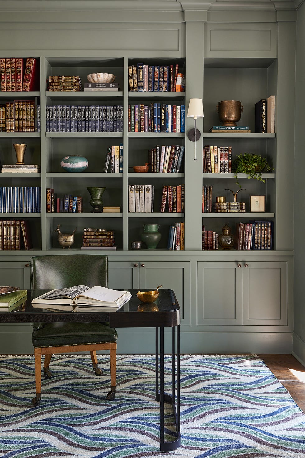 office with a desk and chair and a bookshelf behind it