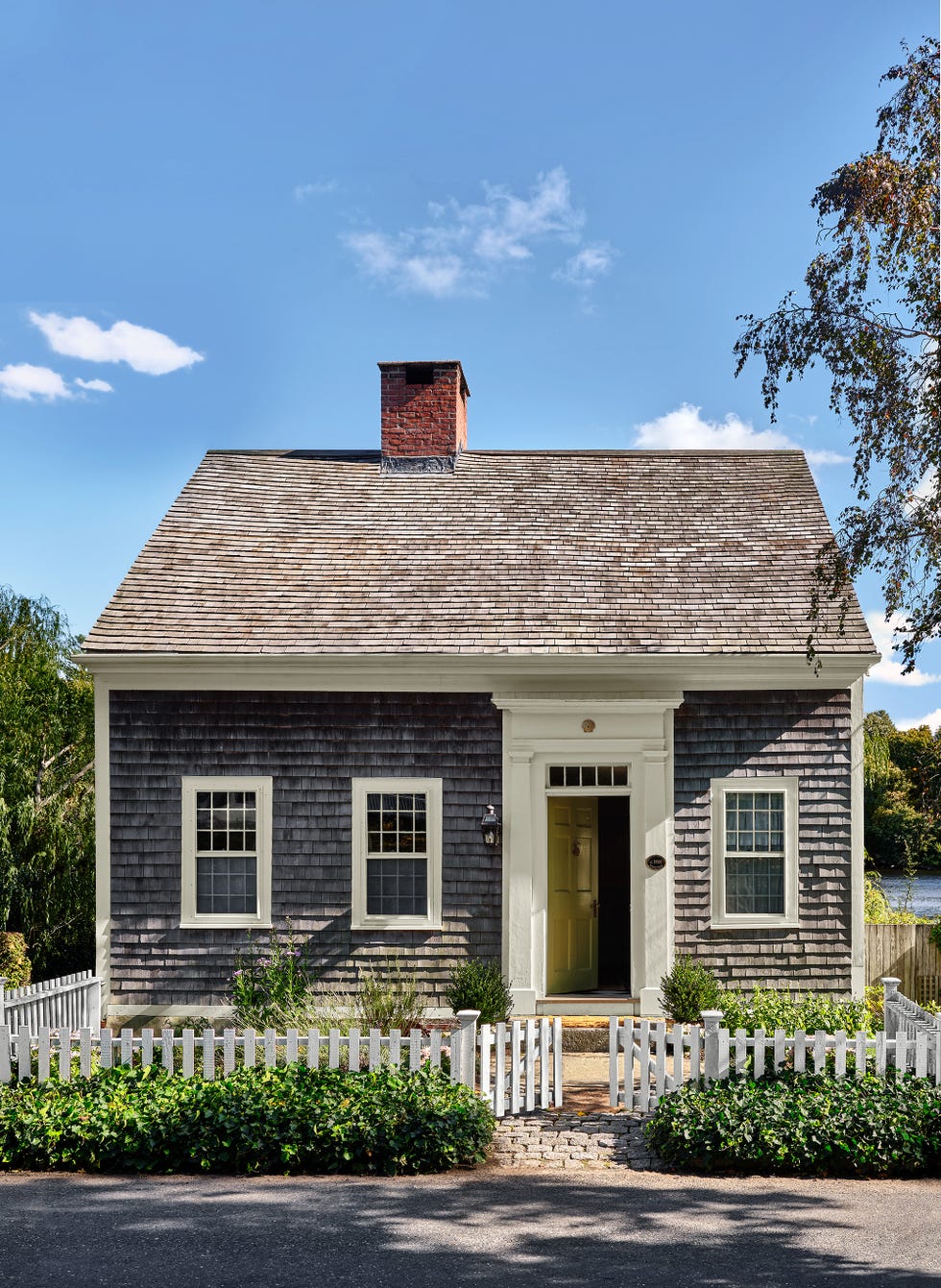 cedar shake cottage with green front door