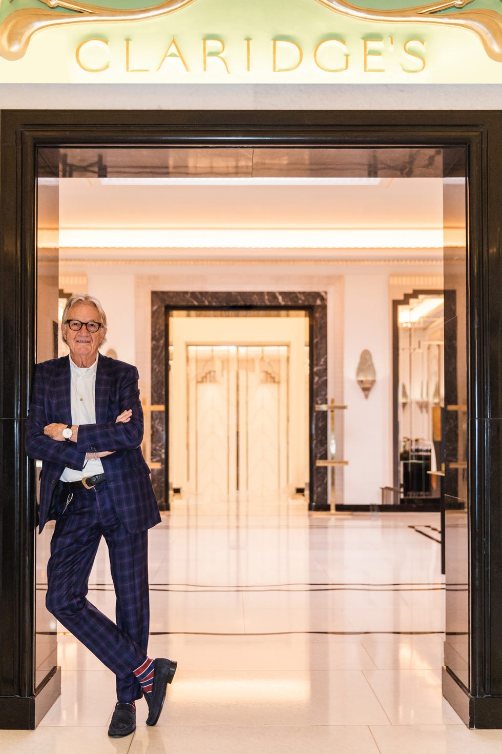 entrance to claridges with a person standing outside