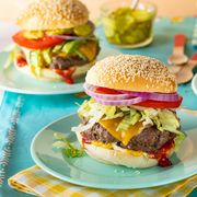 classic cheeseburgers three plates on turquoise