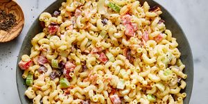 creamy macaroni salad with carrots, celery, and olives