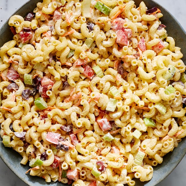 creamy macaroni salad with carrots, celery, and olives