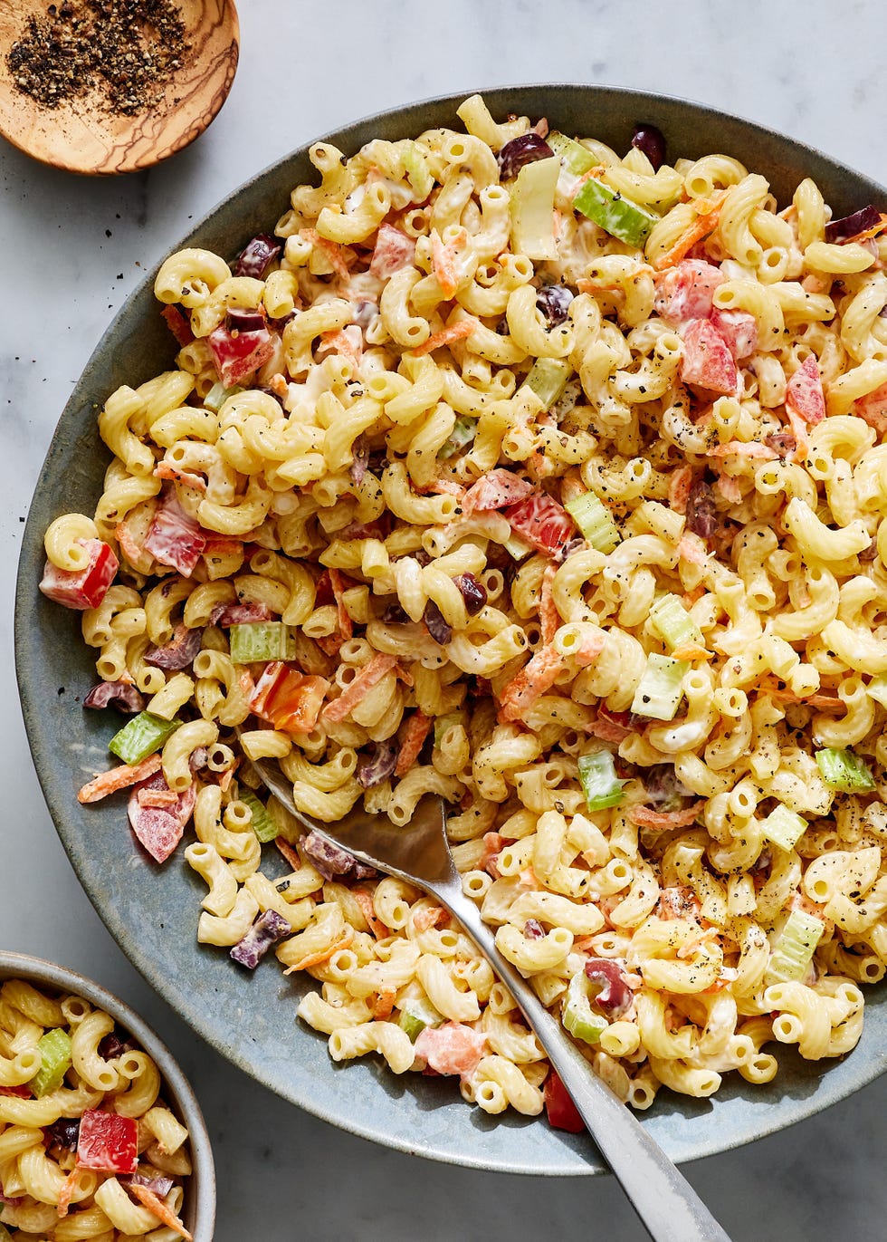 creamy macaroni salad with carrots, celery, and olives