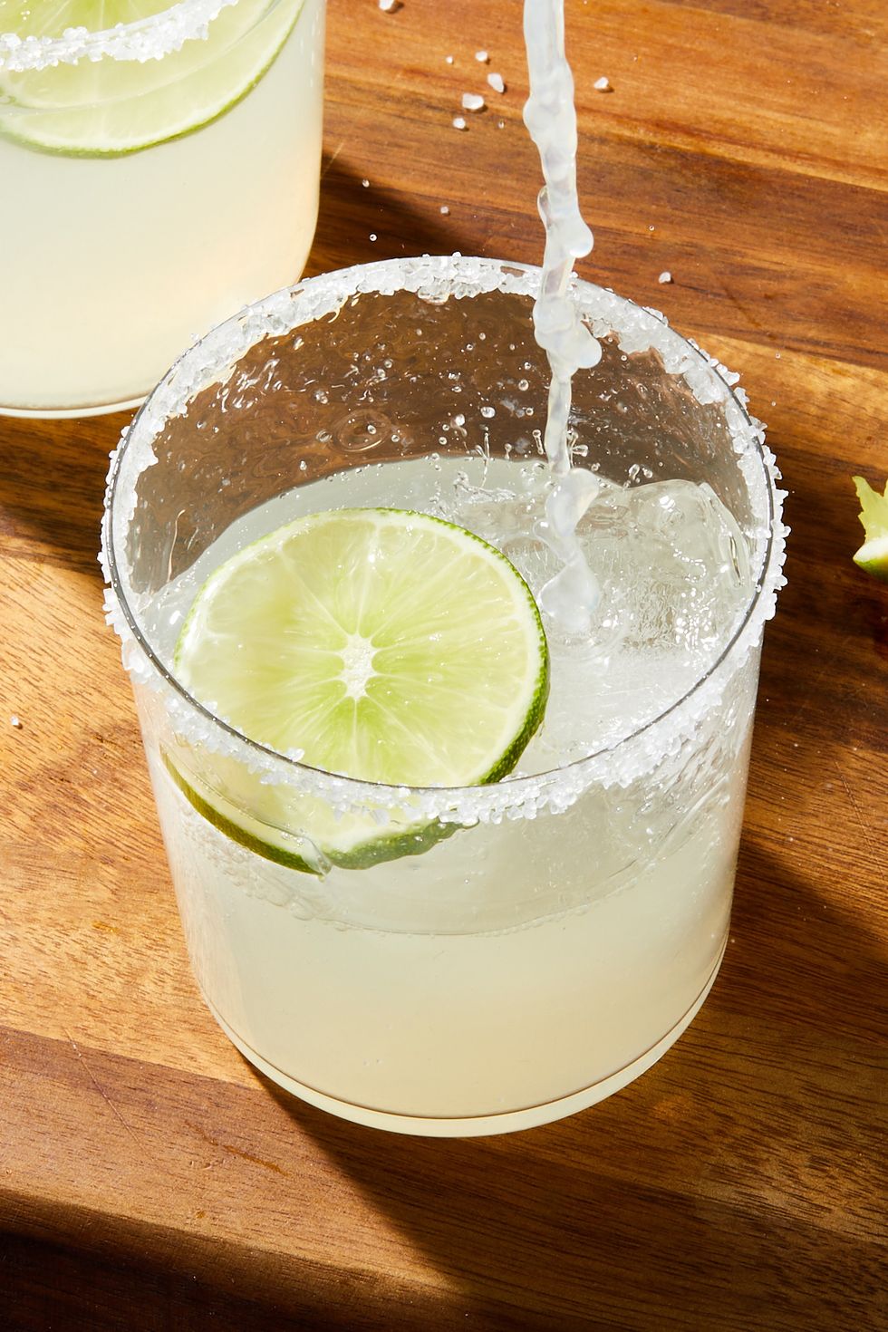 classic margaritas with a salt rim and lime garnish