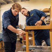 artisan claudio mariani, left, and his colleague jose umansor restore a chair at c mariani antiques in san francisco
