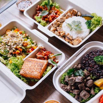 clean food meal boxes rice and rice berry with beef, salmon and chicken in various vegetables and salad for good health