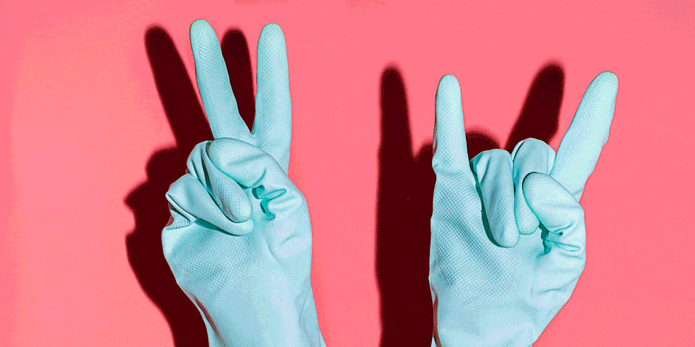 cleaning gloves giving peace sign