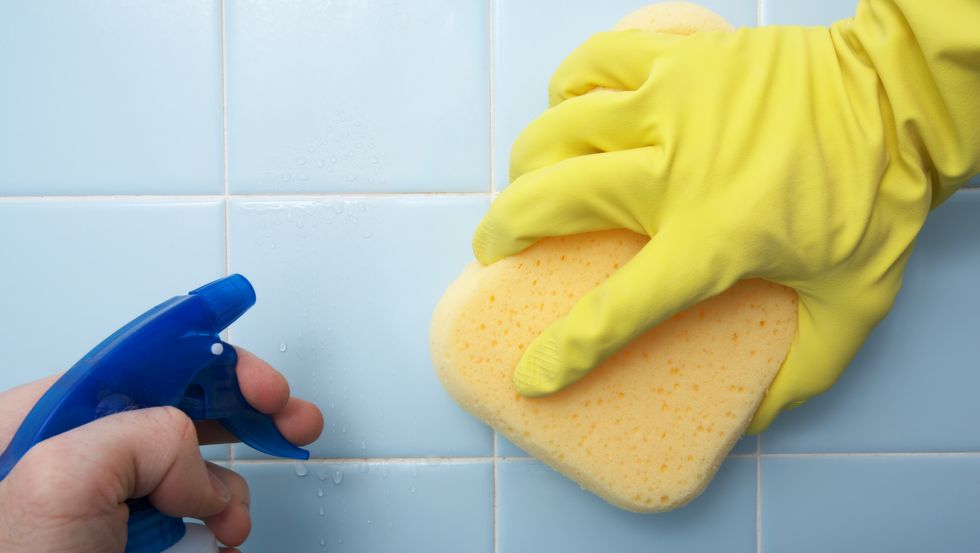 cleaning house scrubbing tile
