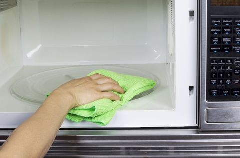 cleaning inside of microwave oven