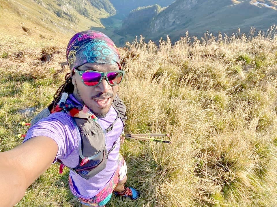 a person taking a selfie in a mountainous outdoor setting