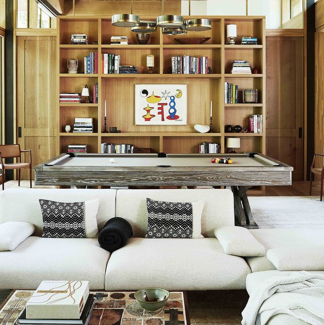 sofa, pool table, and bookshelves in great room