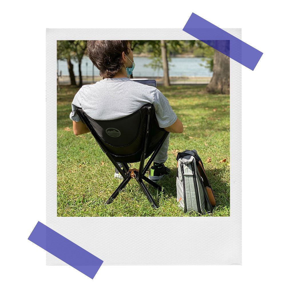 stefan sittting on cliq portable chair in park