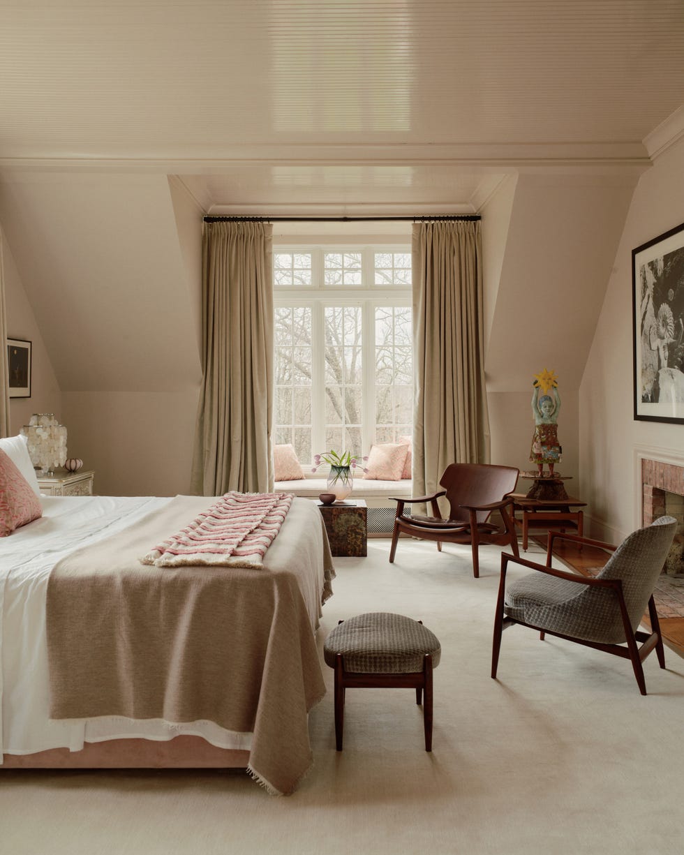 modern bedroom with natural light comfortable seating and stylish decor
