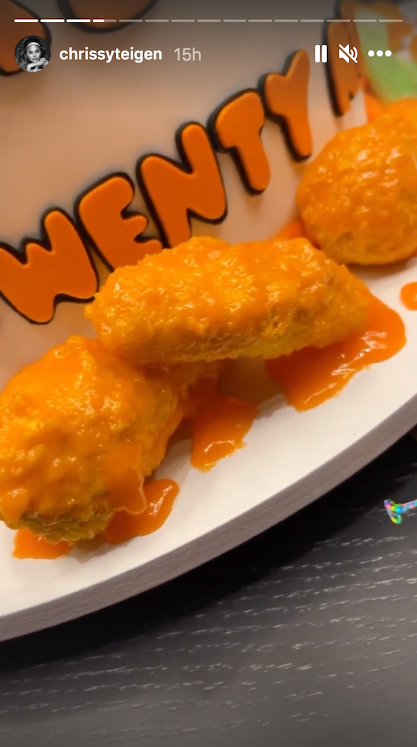 wings dripping in sauce on cake