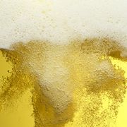close up frothy beer bubbles