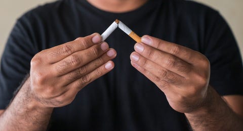 close up hand  breaking the cigarette quit smoking concept