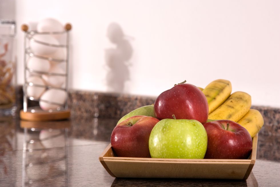 close up mixed fruit bowl in domestic kitchen