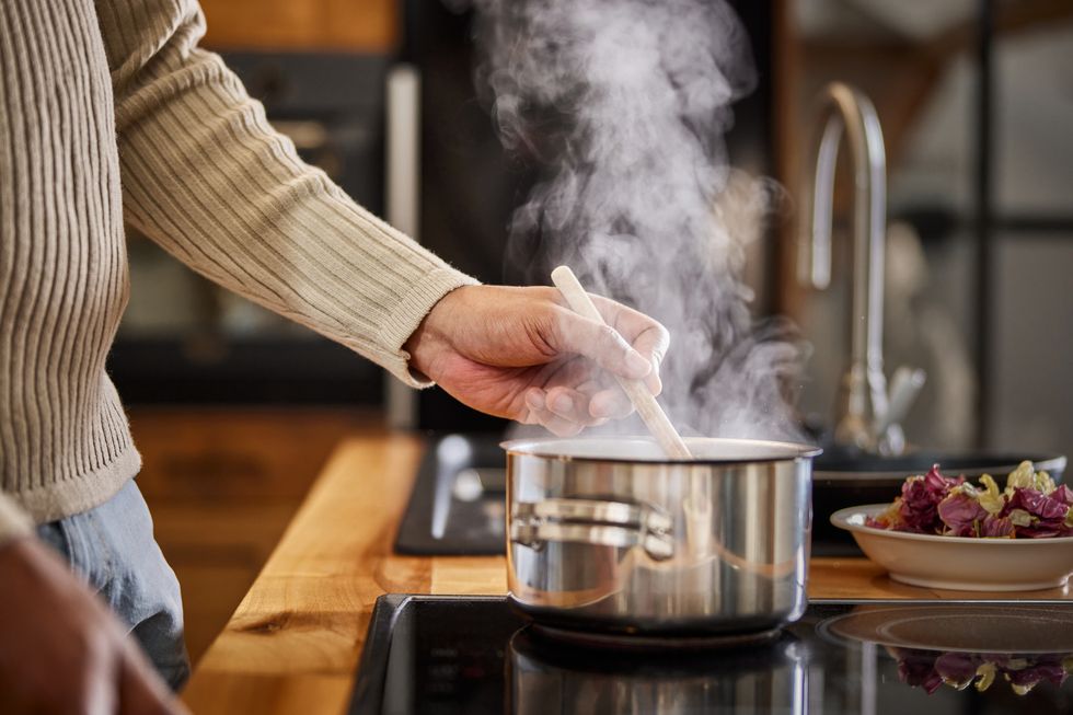 close up of a black bachelor cooking lunch.
