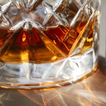 close up of a glass of whisky in the sunshine