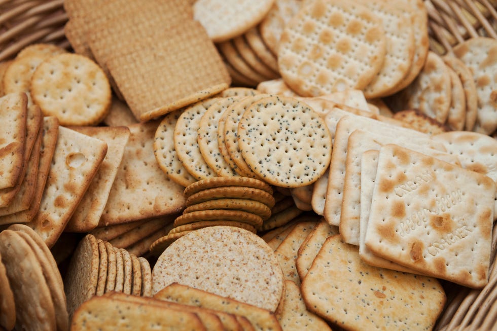 Close up of a large selection of cream crackers.