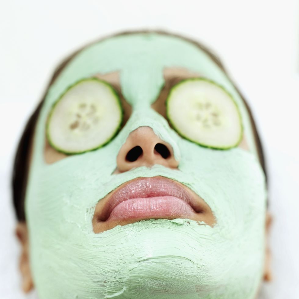 close up of a young woman's face with a face mask on it