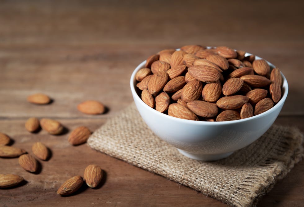 close up of almonds in bowl on table