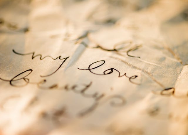 close up of antique love letter on parchment 