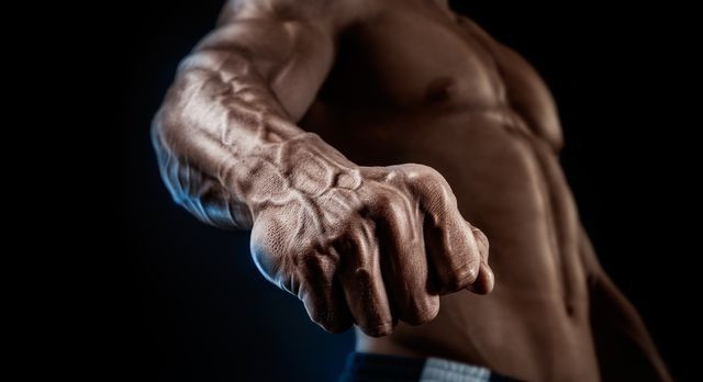 Close-up of athletic muscular arm and torso