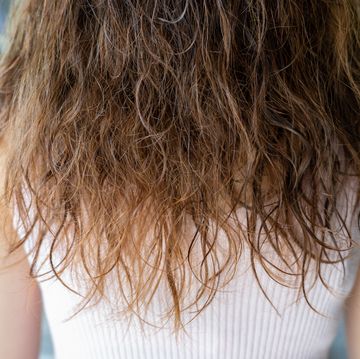 close up of back view of woman with her wet hair after shower