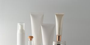 close up of beauty products against gray background